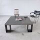 Table basse minimaliste en béton ciré et acier massif 1m20x1m20
