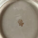 Four beige speckled plates