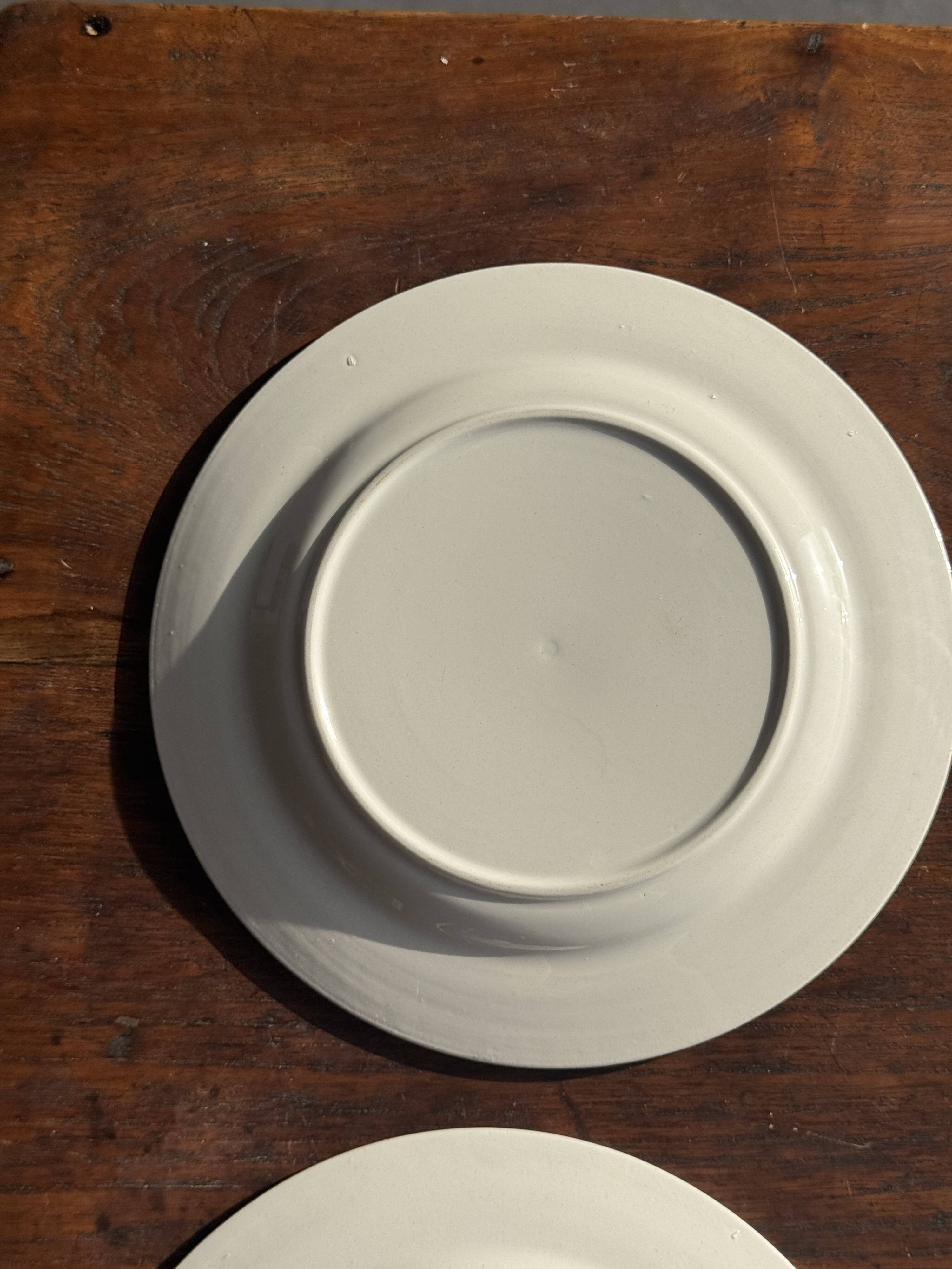 Set of 4 small dessert plates with a vintage stylised flower pattern.