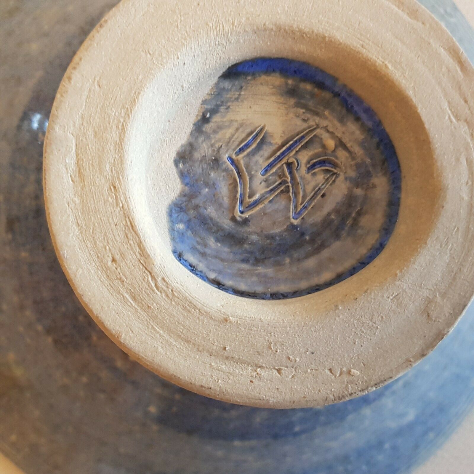 Empty pocket bowl cup on ceramic pedestal with signed spike holes