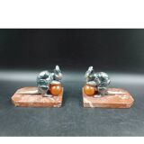 Antique Art Deco bookends in silver-plated metal, bakelite, and marble, signed H. M.