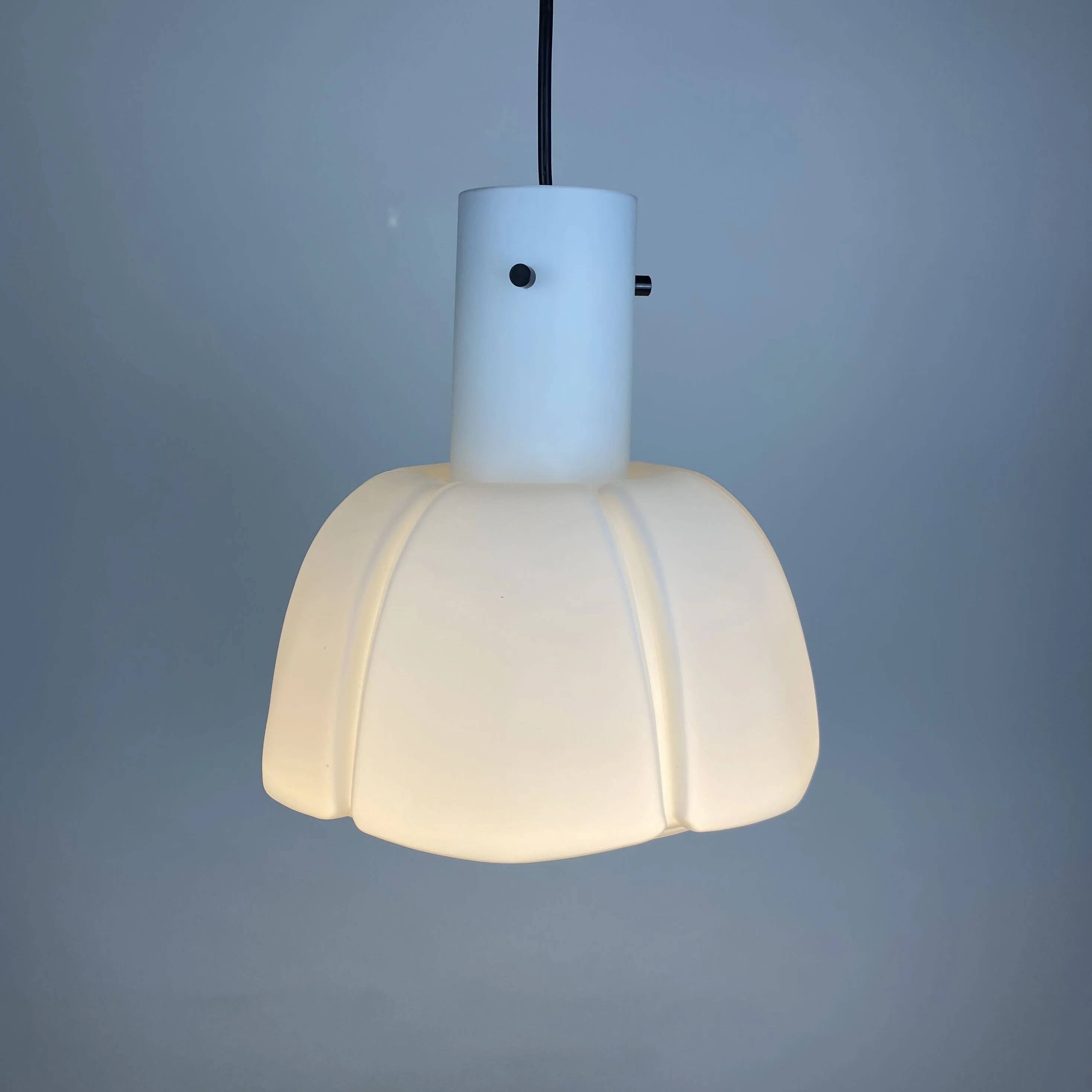Frosted glass pendant in the shape of a white flower by Glashütte Limburg.