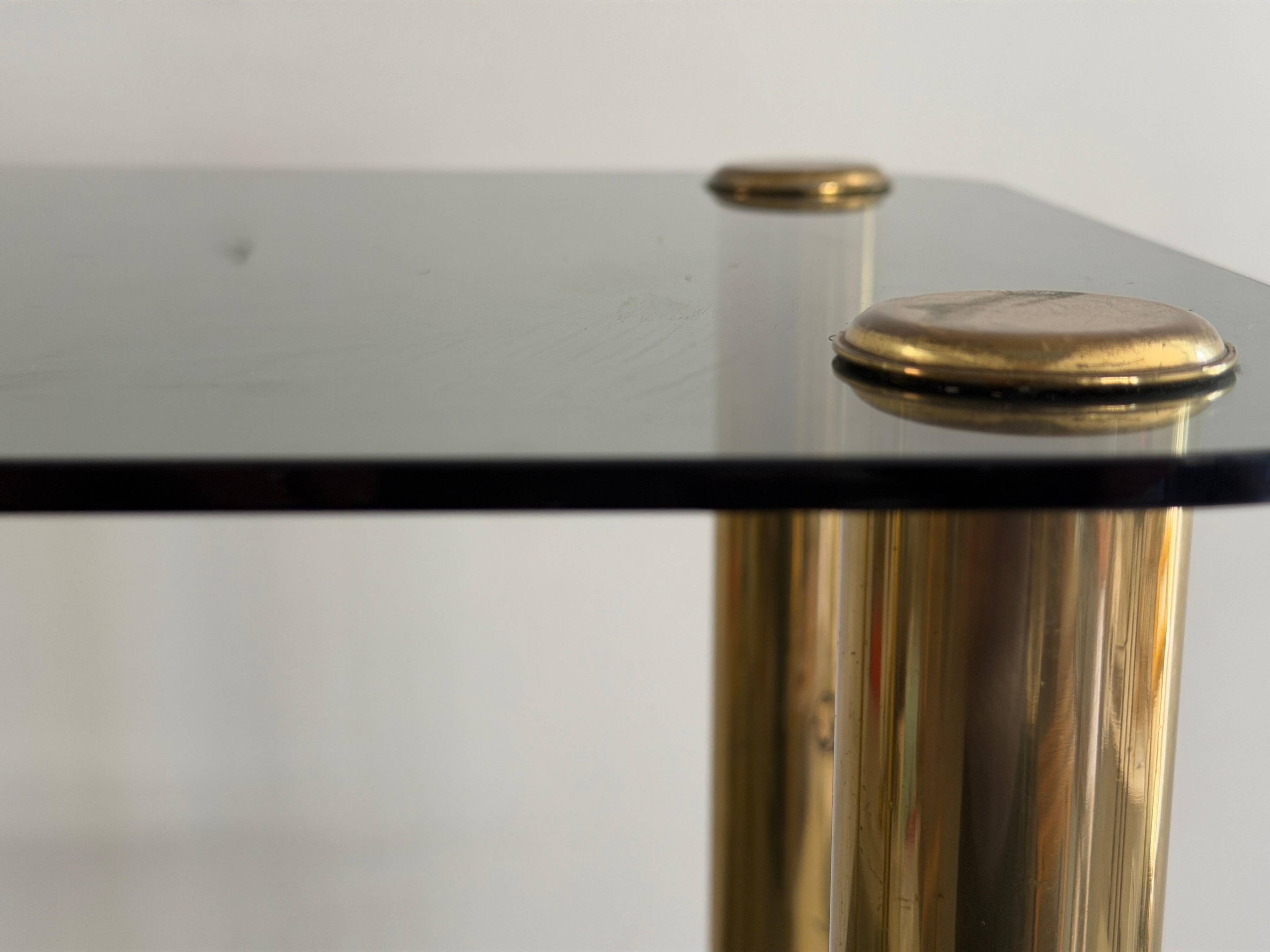 Side table in thick greenish glass with brass legs, Italy, 1960s.