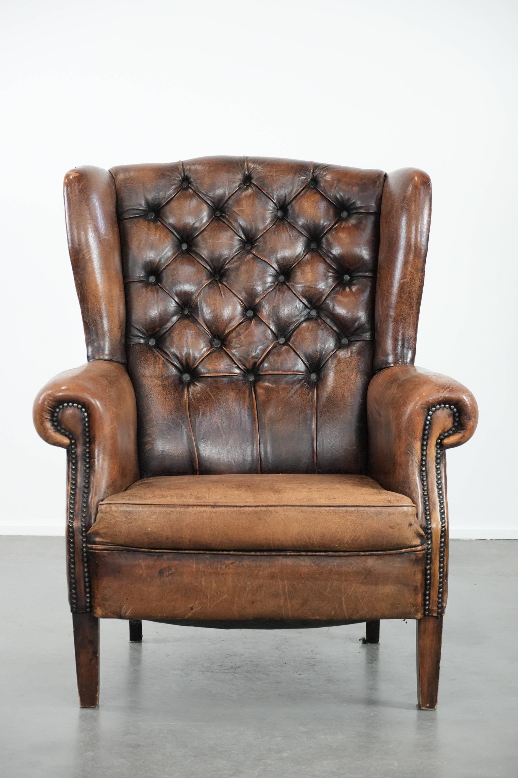 Unique large sheepskin Chesterfield wingback armchair in English style