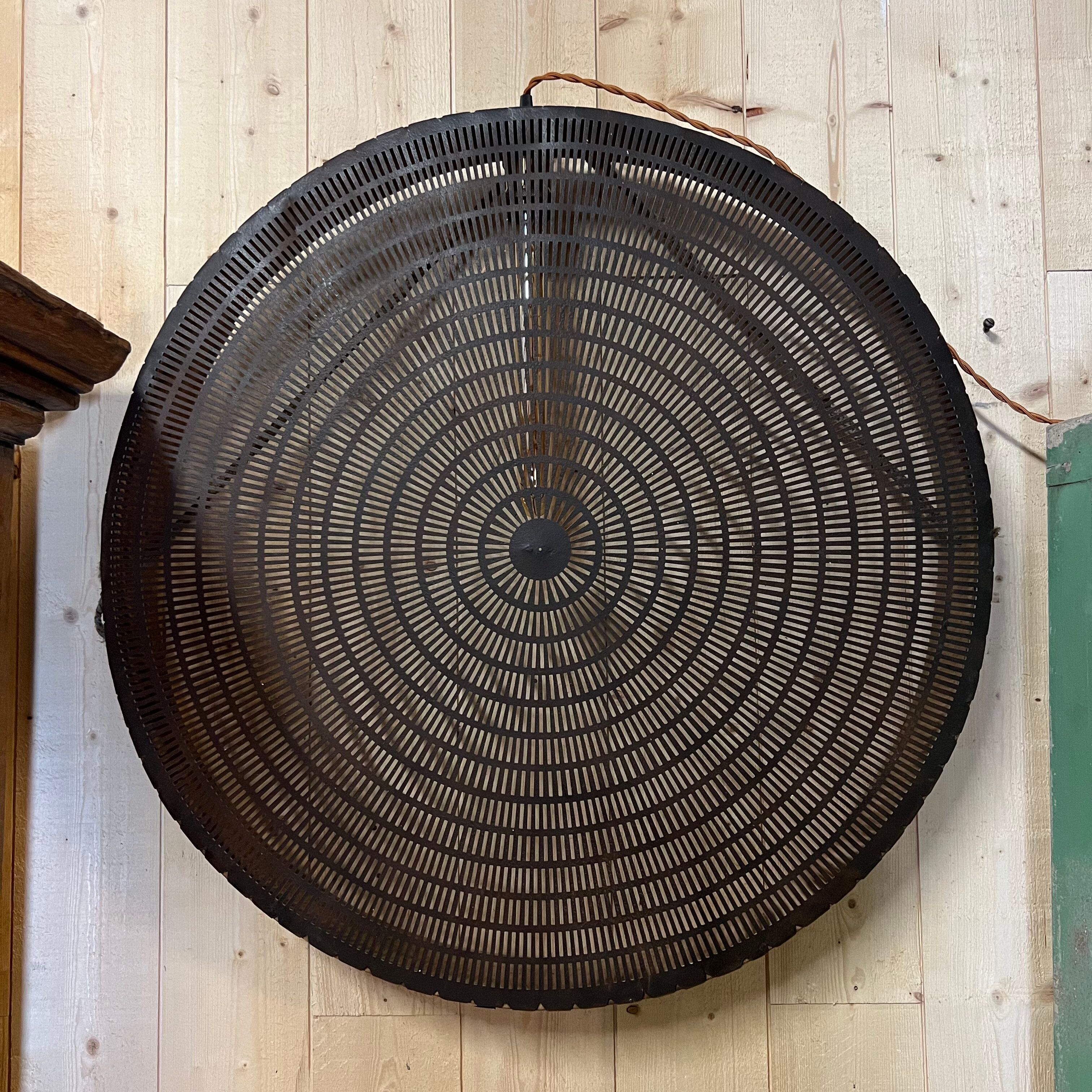 Old lamp in wood and metal worked with integrated lamp.
