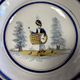 Large centrepiece table dish in earthenware with a painted decoration of a drummer.
