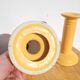 Pair of yellow ceramic candlesticks