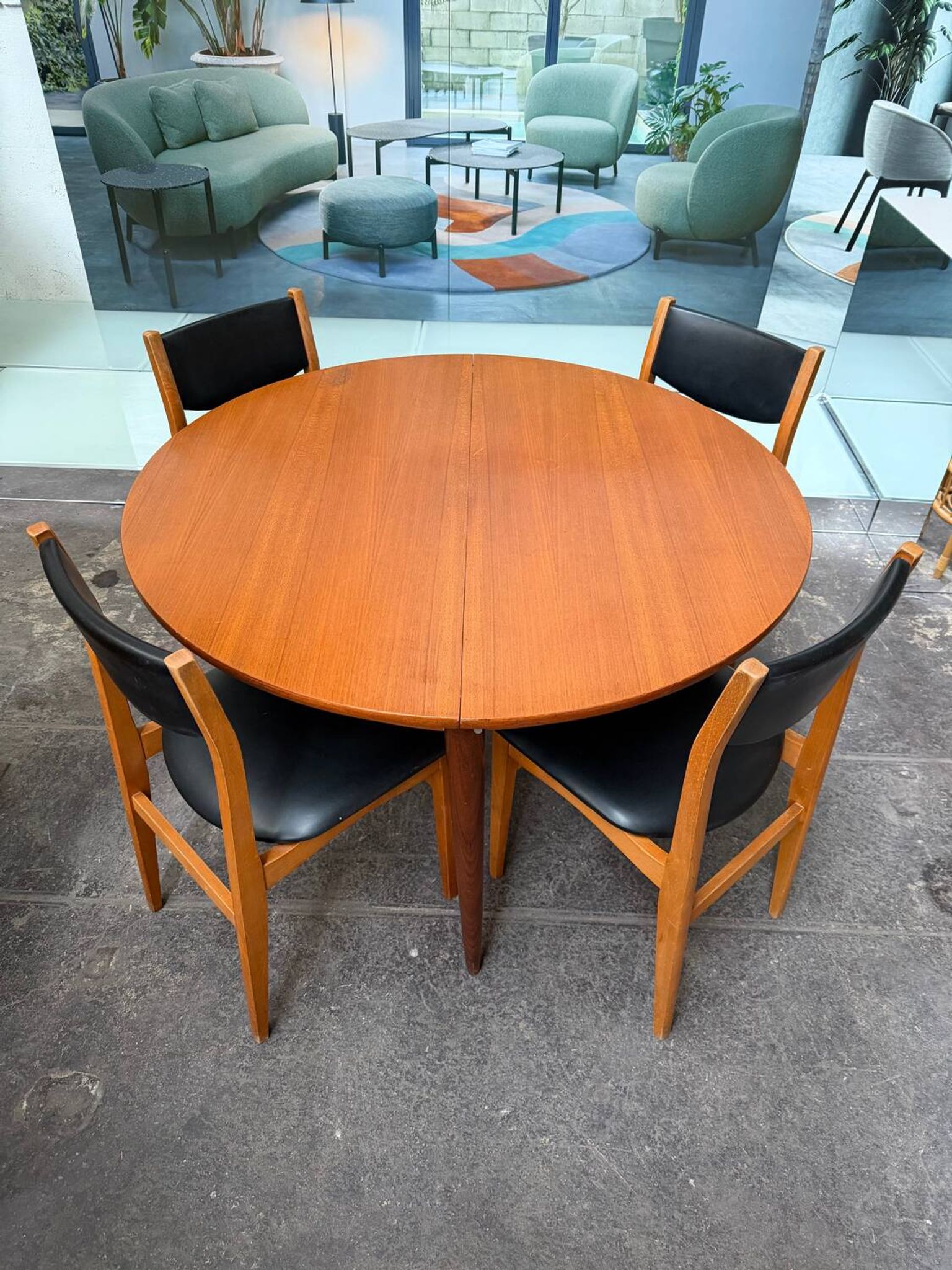 4 Scandinavian chairs in teak and black faux leather.