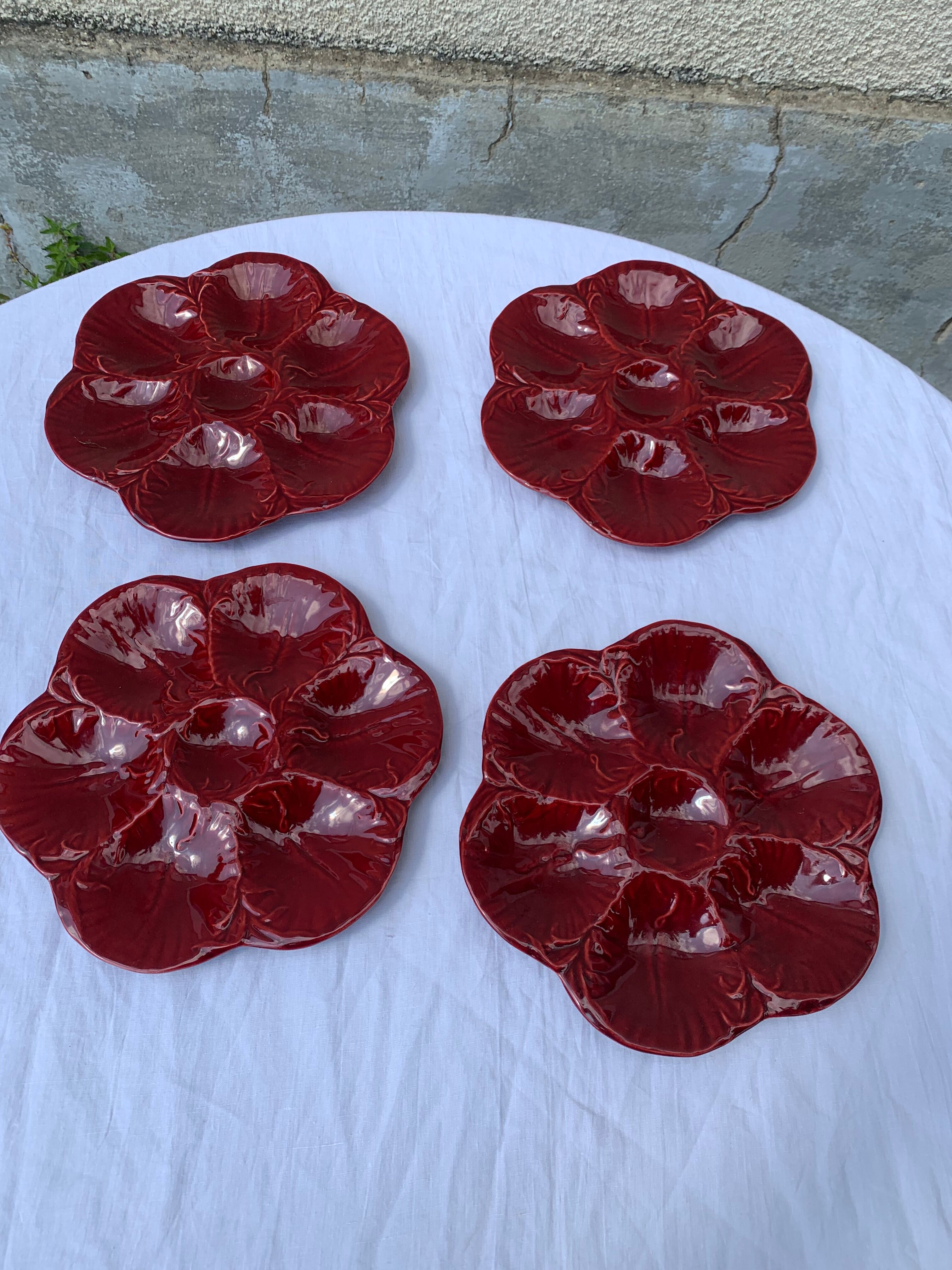 4 oyster plates in vintage red glazed ceramic slip and collector