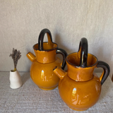 Enameled jugs signed Gomares