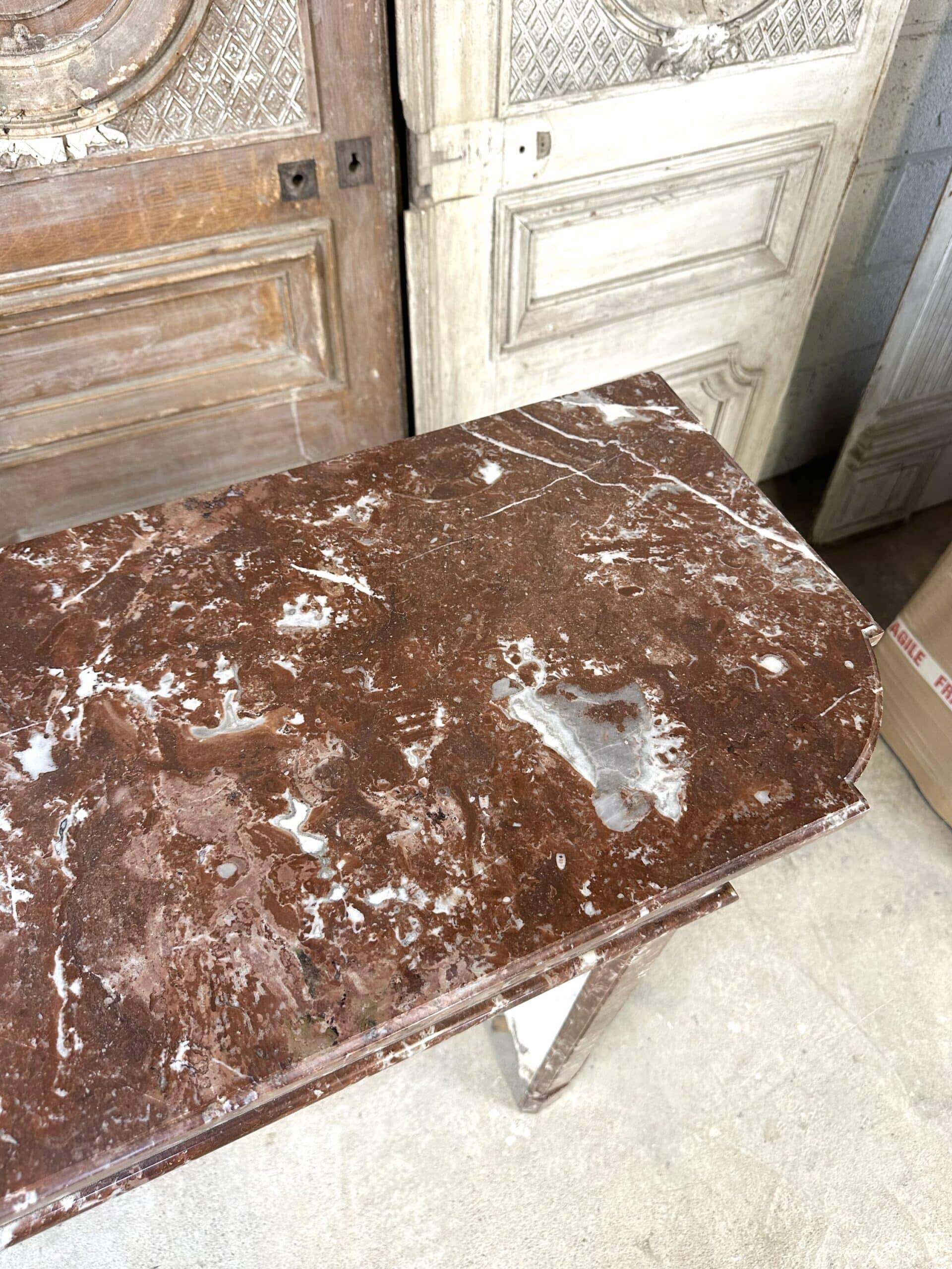 Red marble fireplace in the Louis XVI style, late 19th century