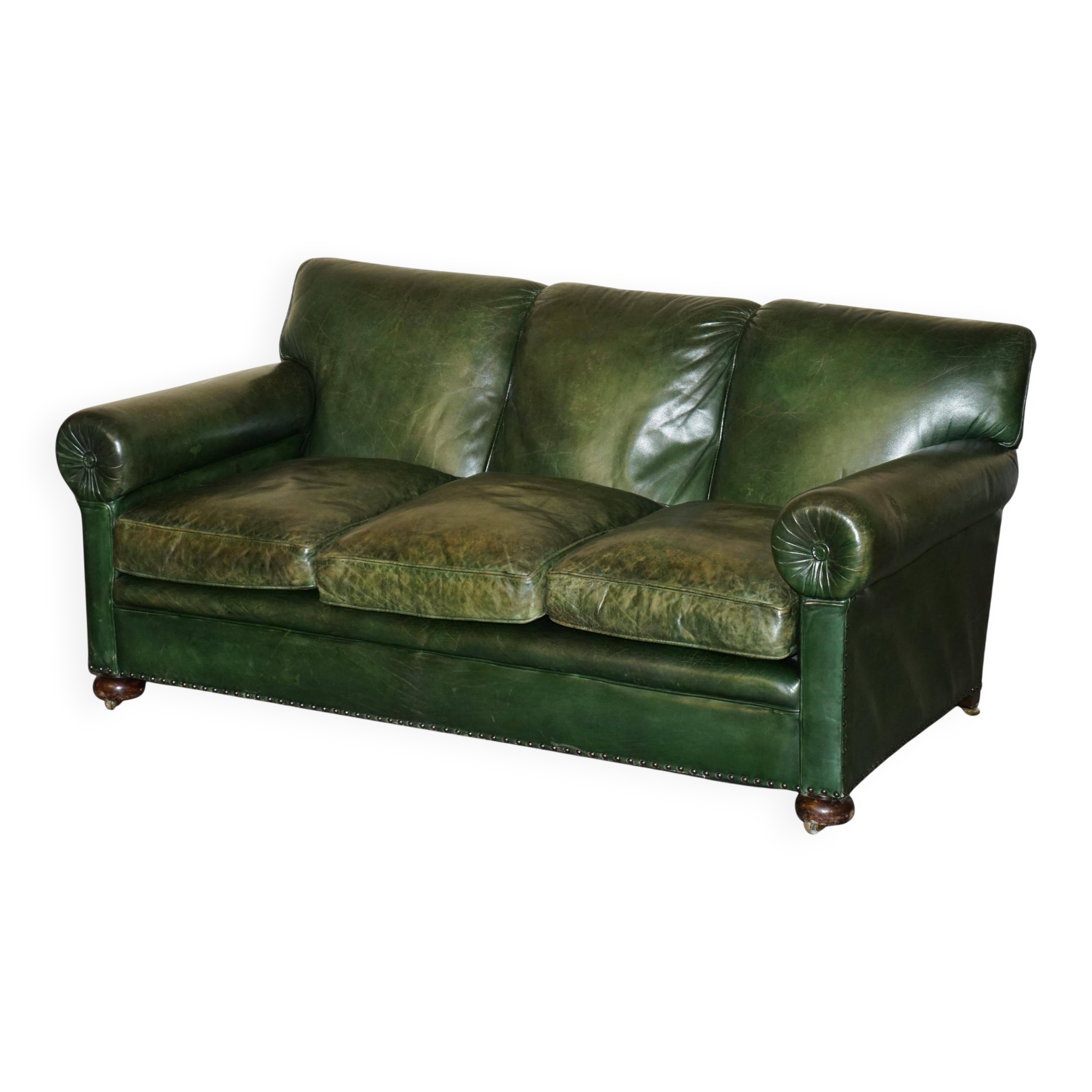 Victorian leather canapé, shield armrests, stamped Maple & Co.