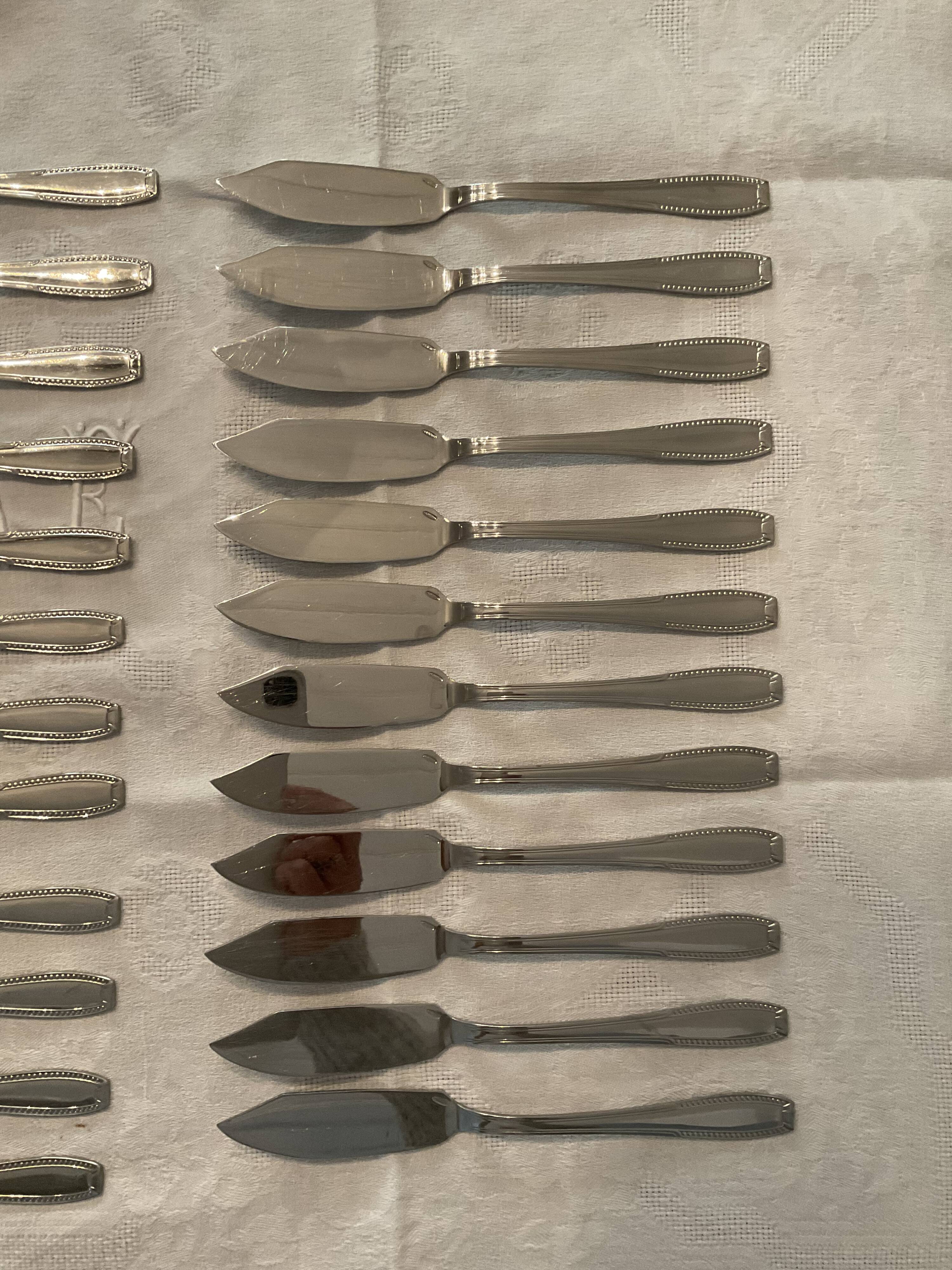 24 fish covers. Forks and knives . Stainless steel. Vintage