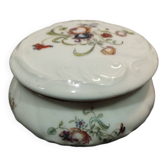 Old white porcelain candy box and floral decoration