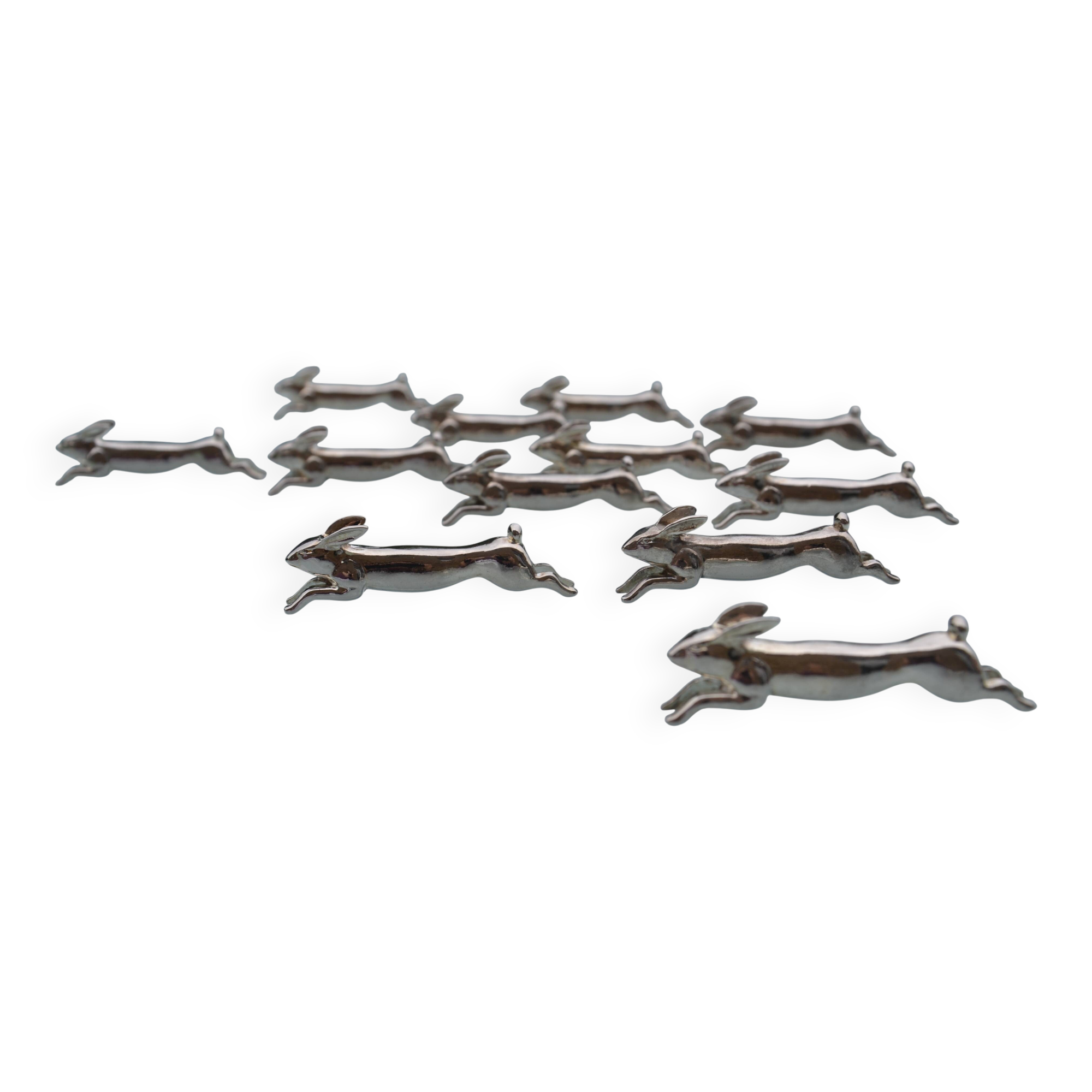 12 silver-plated metal "rabbit" knife rests