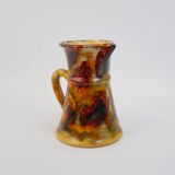 Beautiful ceramic pitcher in fire colors