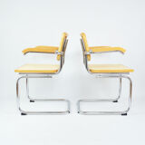 A pair of chairs with armrests, 1970s