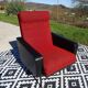 Vintage armchairs in red and black faux leather, the pair.