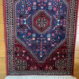 Small Persian wool rug
