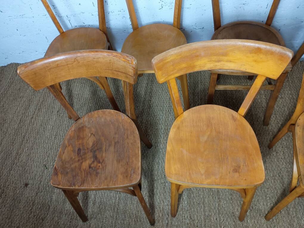 Set of 9 mismatched bistro chairs, 1950s.