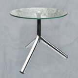 Modernist tripod side table in tempered glass and chrome metal.