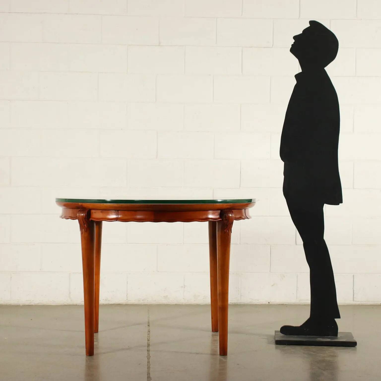 Table in solid beech, mahogany veneer and glass, Italy, 1950s.