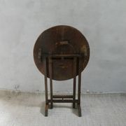 Small table known as a winemaker's table.