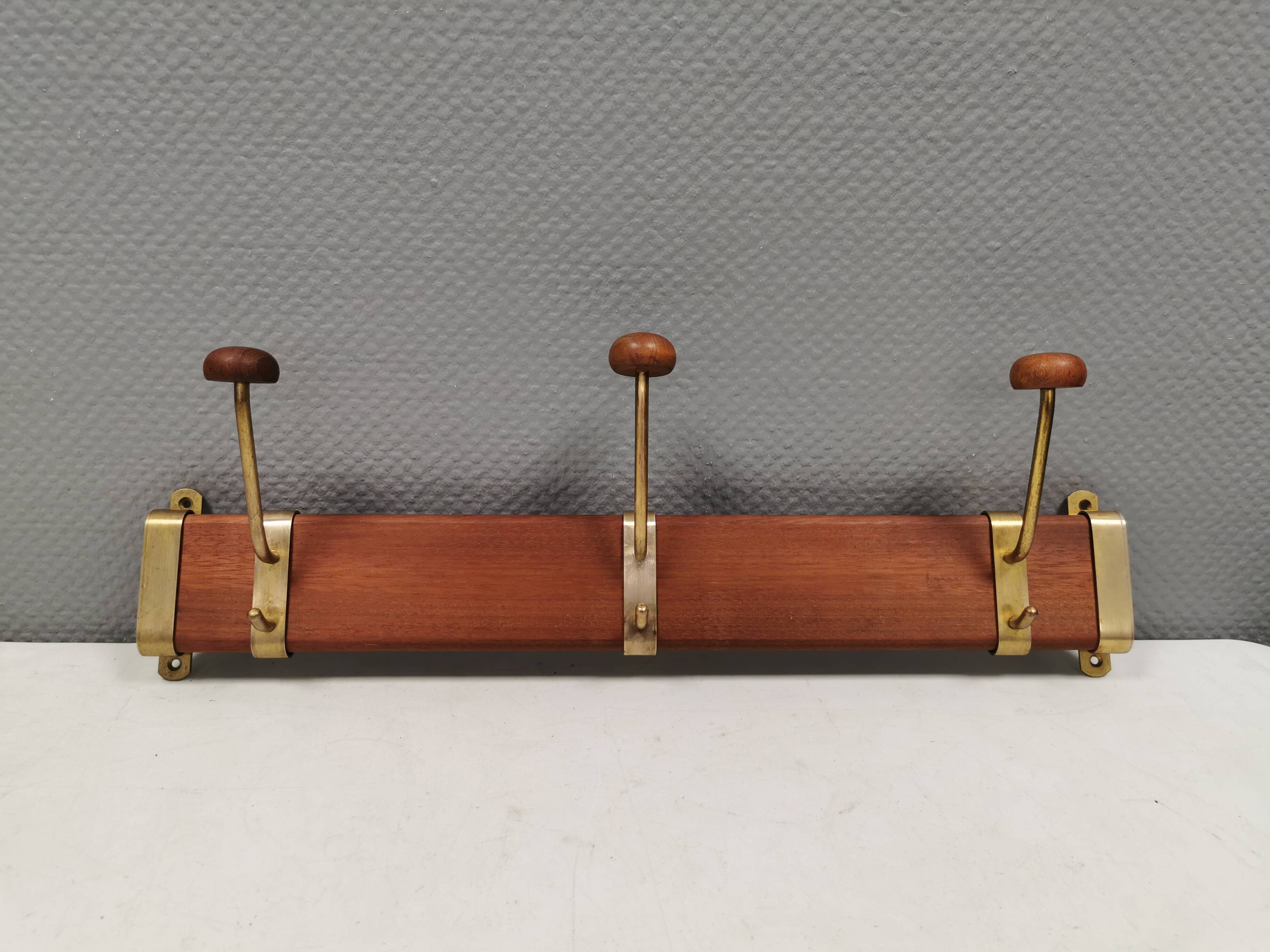Danish teak and brass coat rack with adjustable hooks, 1960s.