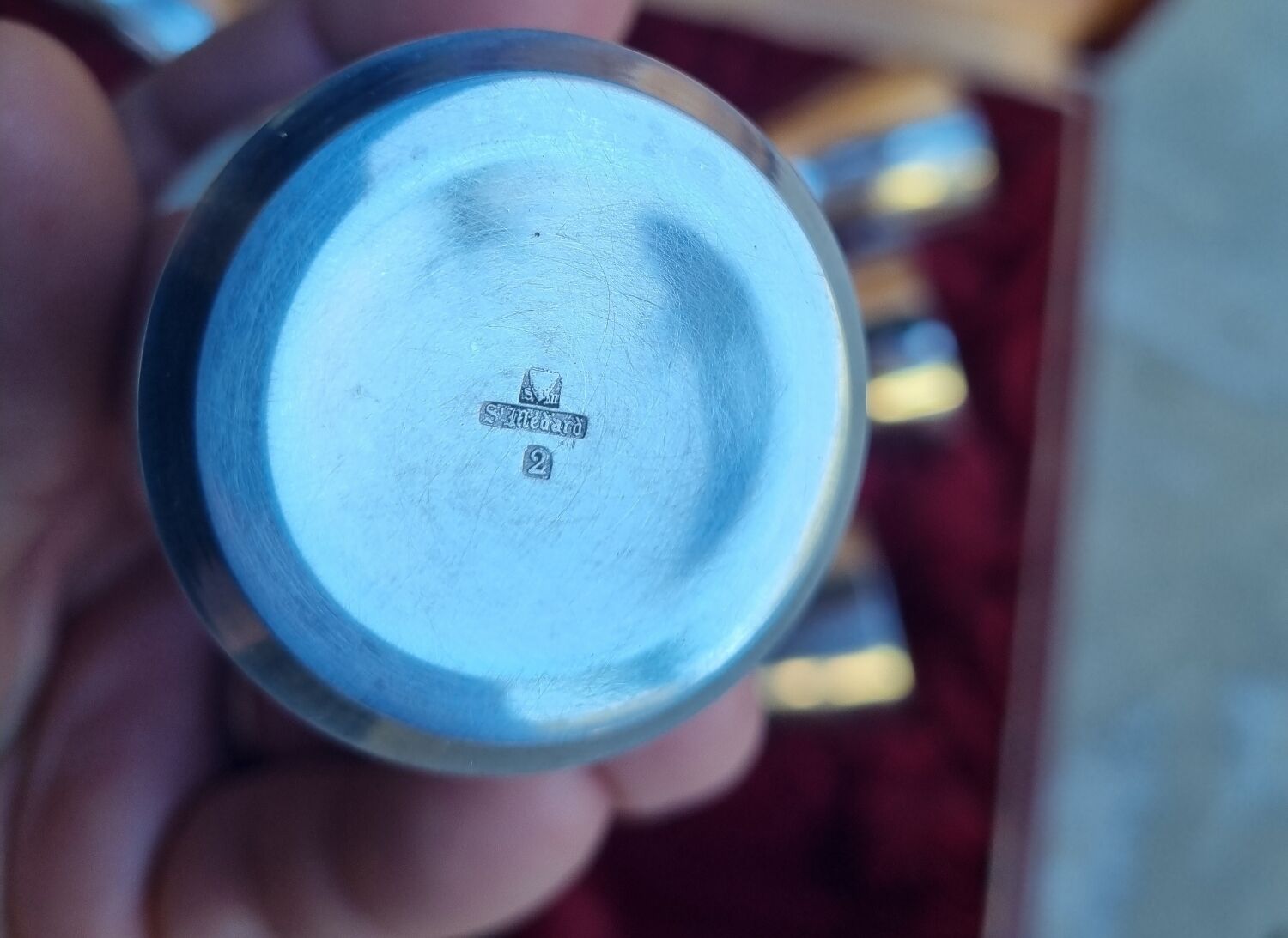 Shaker and 8 silver St Médard cups