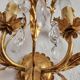 Hand-forged wall lamp gilded with gold leaf and crystals, Italy