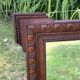 Antique carved wooden mirror
