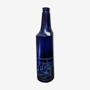 Surreal blue glass bottle, designed by Salvador Dali