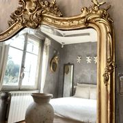 Antique gilded Louis XV pediment mirror