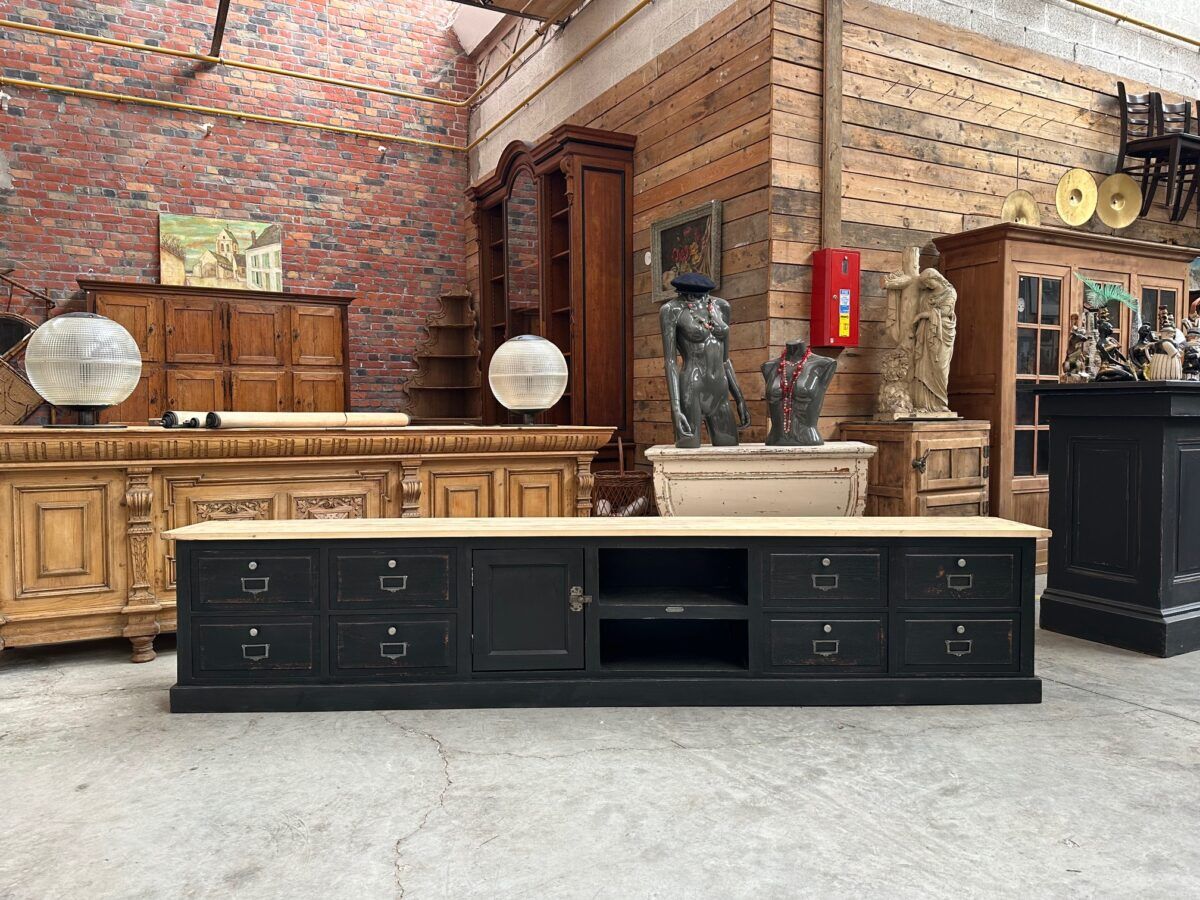 Old workshop furniture transformed into a TV unit.