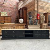 Old workshop furniture transformed into a TV unit.