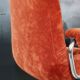 Orange velvet swivel armchair