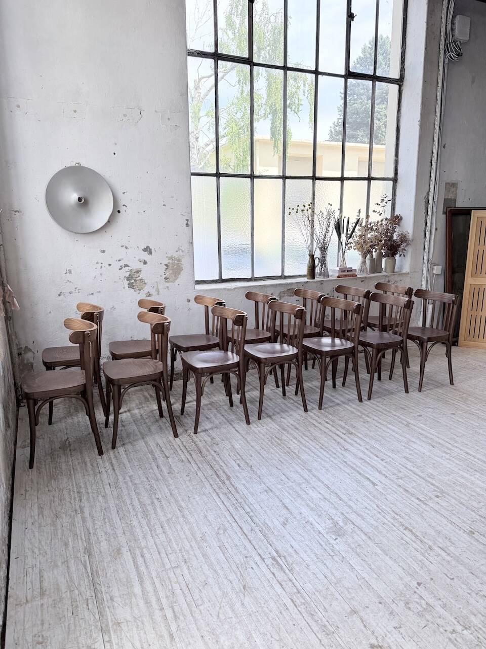 Set of 14 walnut bistro chairs.