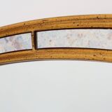 Mirror by Deknudt with marbled fume glass side panels in gilded wooden fram