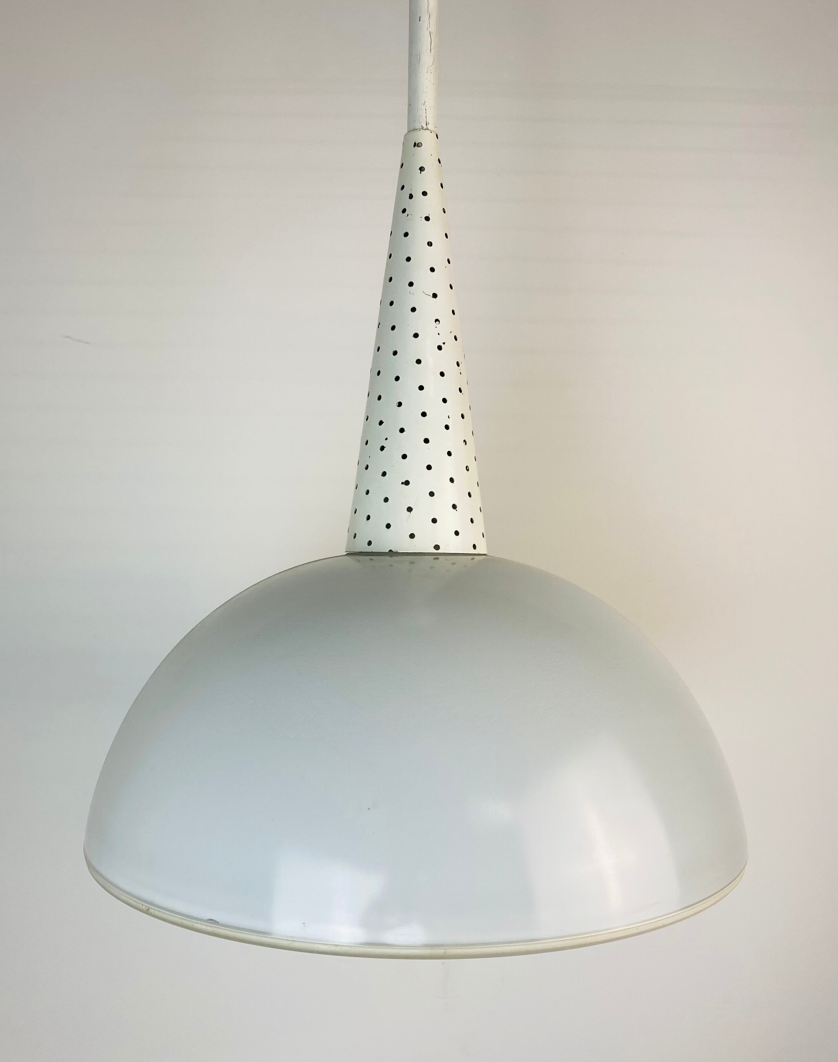 Perforated metal suspension holophanous glass