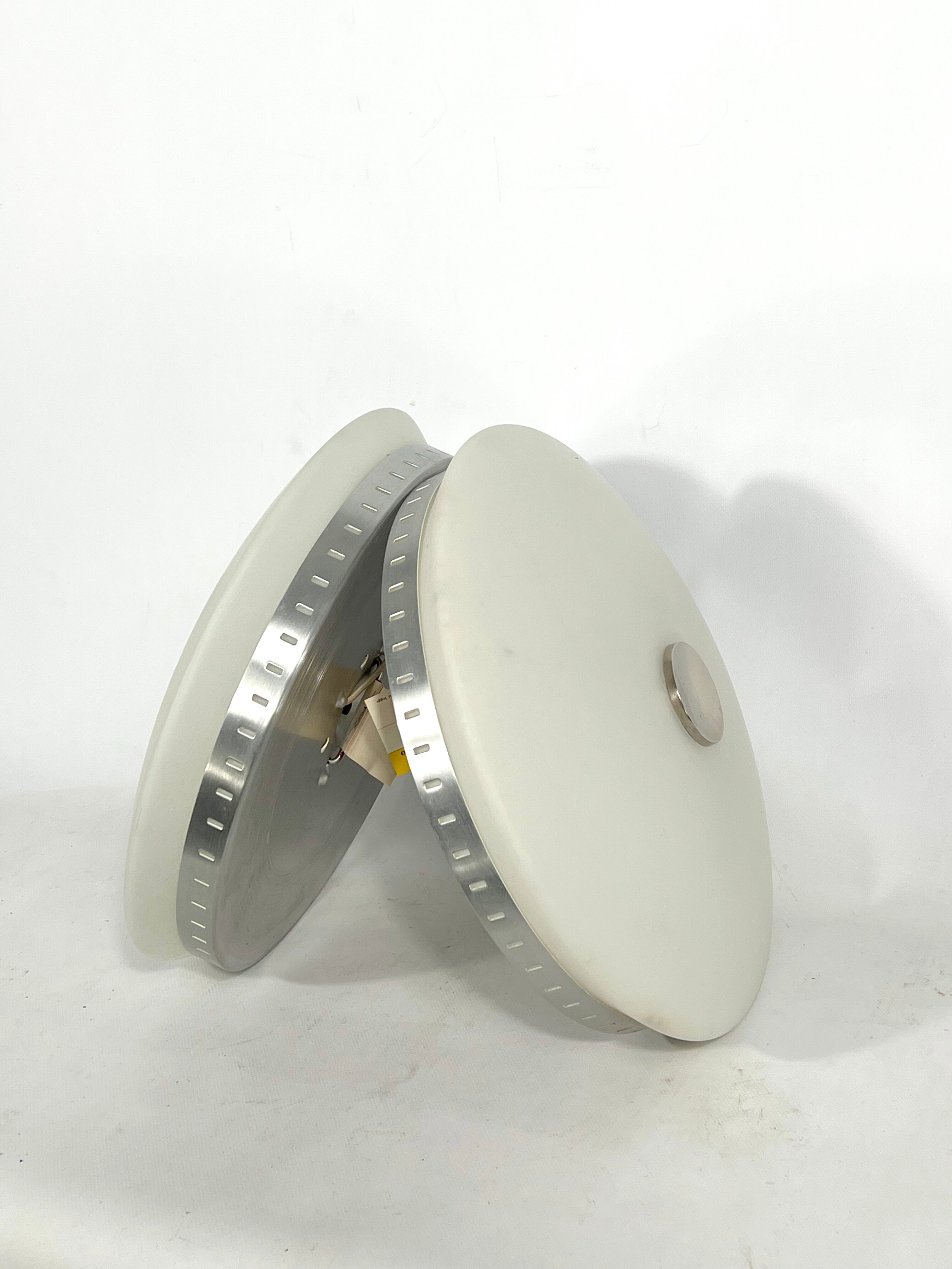 Stilux Milano, pair of round opaline glass ceiling lamps. 1960s