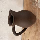 Ancient pitcher in earth