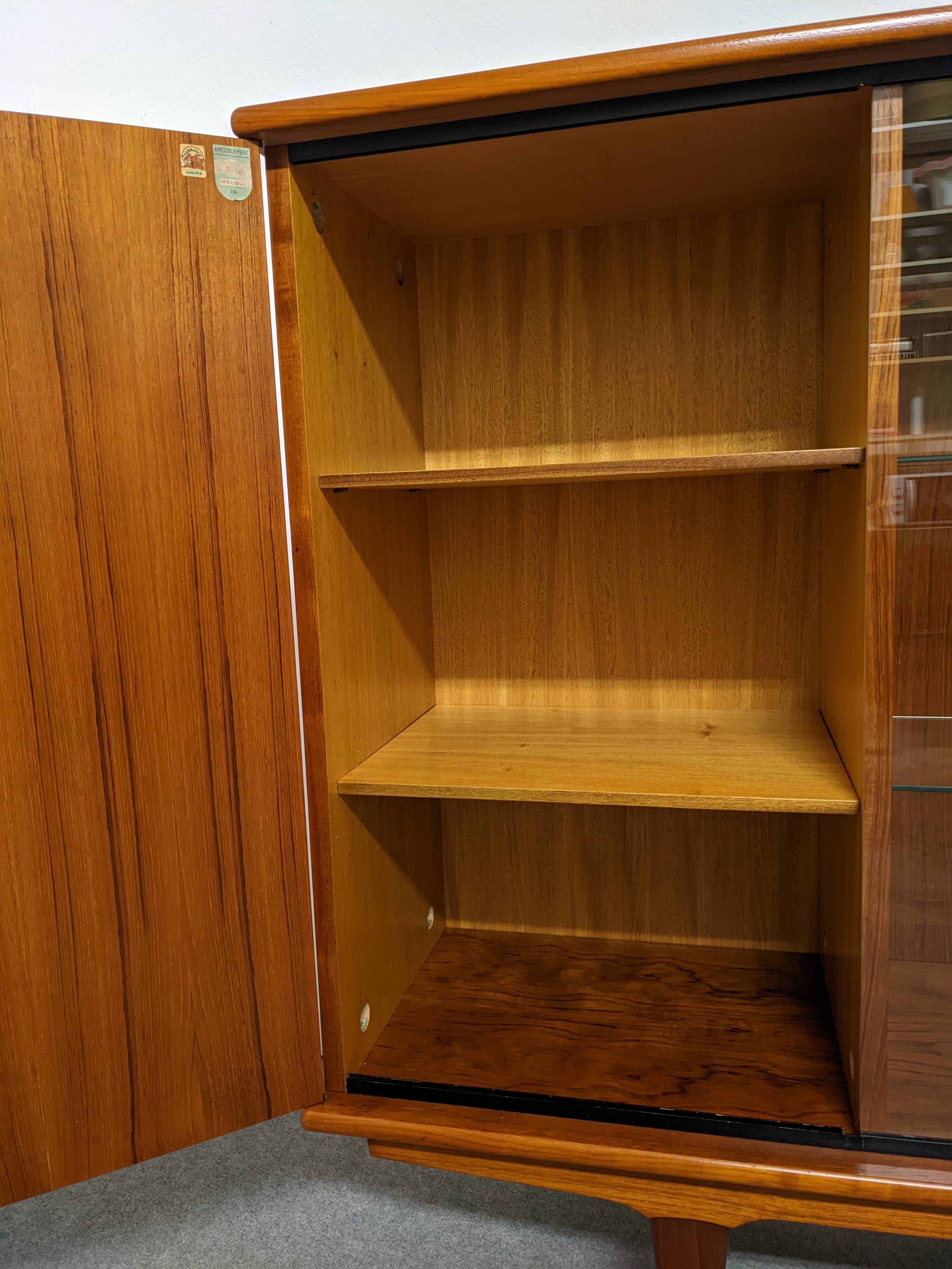 High sideboard, display cabinet and secretary, Scandinavian in teak, France around 1960.