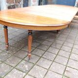 Extensible Napoleon III table in walnut, late 19th century.