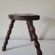 Tripod stool with turned wooden legs