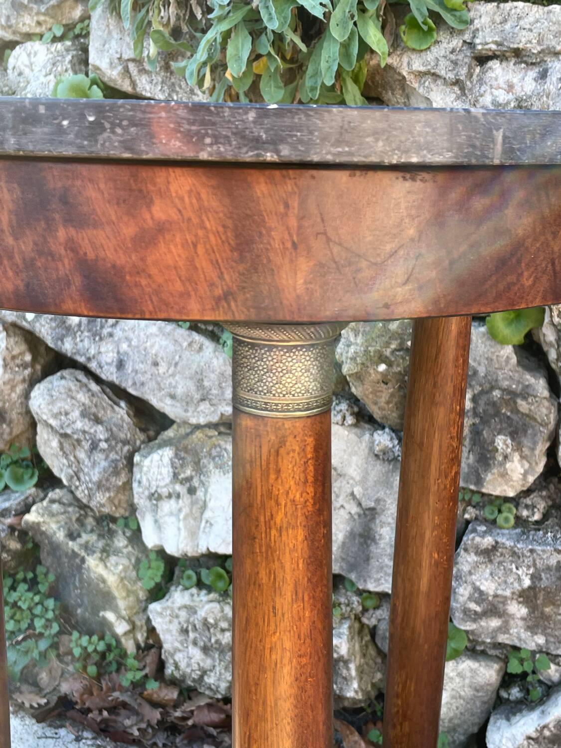 Empire style mahogany and mahogany veneer tripod pedestal table