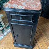 Chest of drawers with a red marble top.