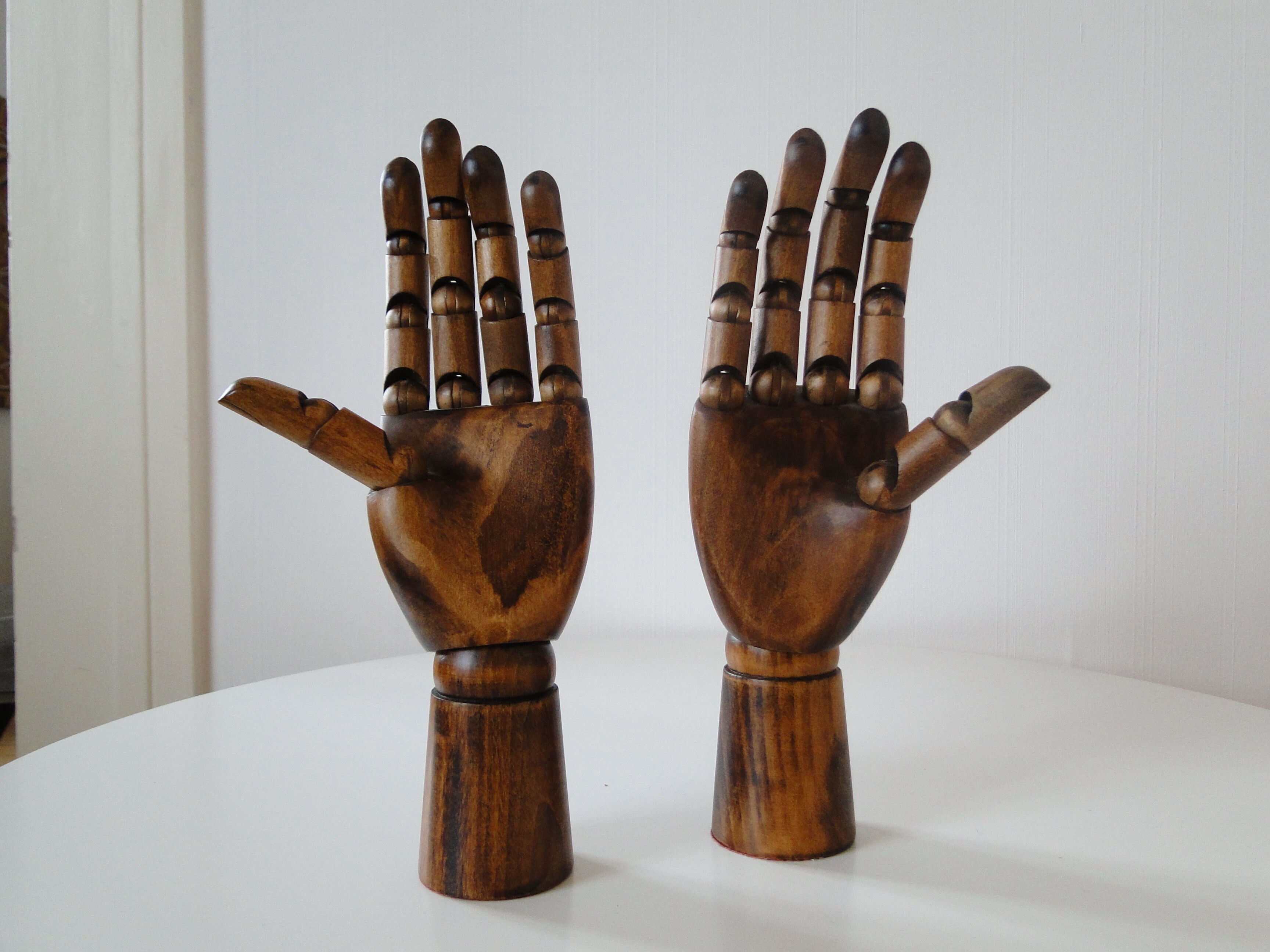 Pair of articulated wooden hands