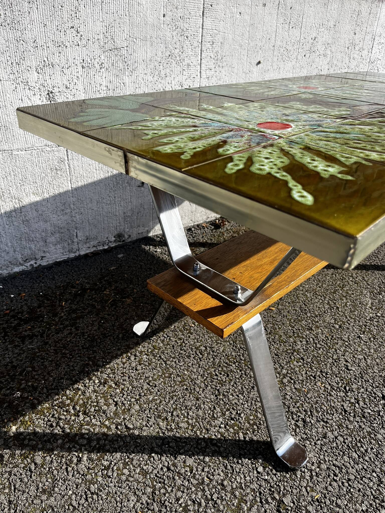 Vintage ceramic coffee table, floral patterns and chrome base.
