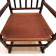 Fauteuil Manou en rotin et assise en cuir, 1960