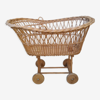 Rattan cradle for doll on vintage wheels